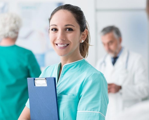Young female medical assistant working at the hospital and medical staff