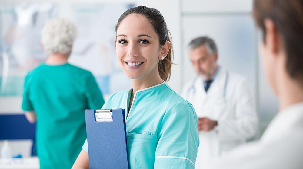Young female medical assistant working at the hospital and medical staff